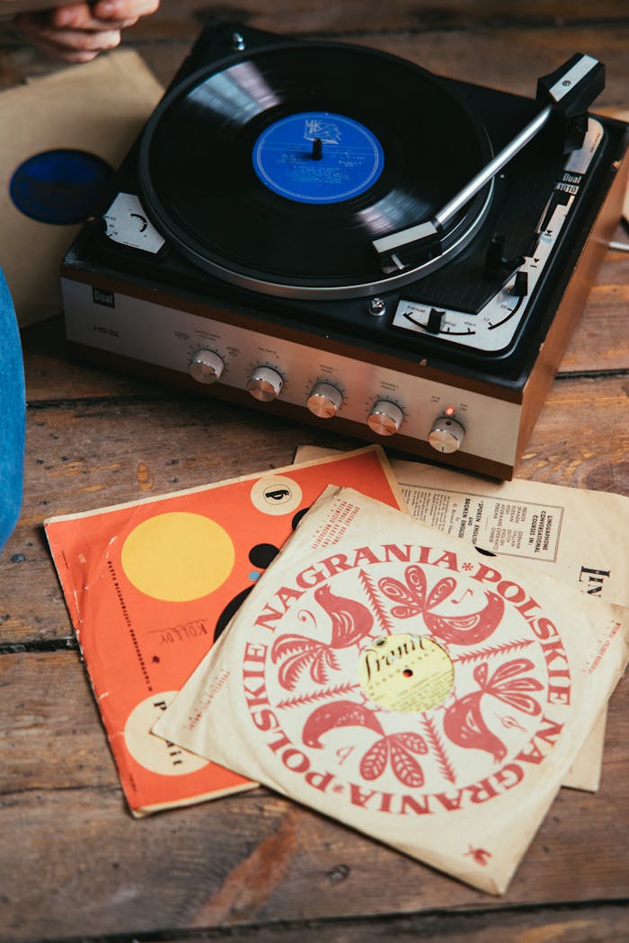 A nostalgic setup featuring a vintage record player and classic vinyl records.